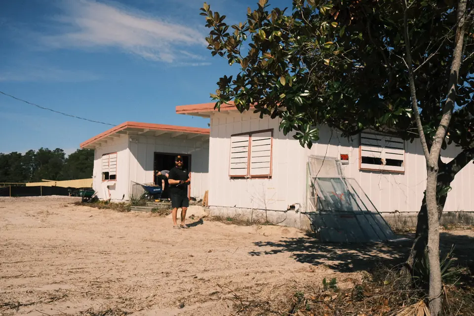 The Benning Drive house on a sandy lot before the remodel